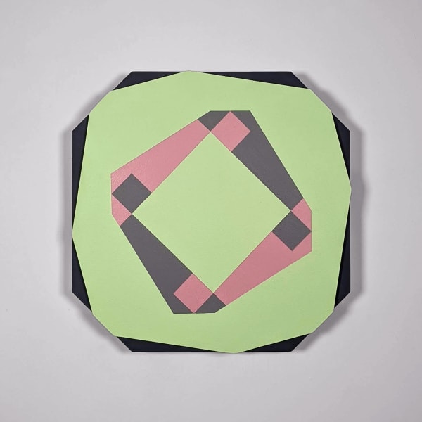 Photograph of an irregularly shaped geometric abstract painting on a white wall