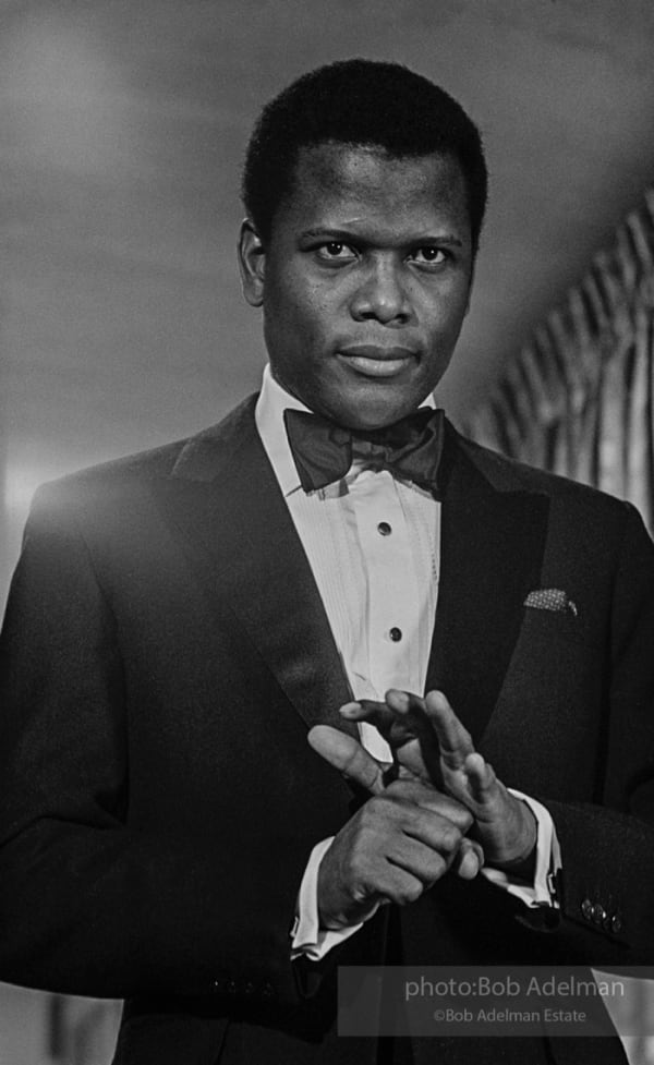 Sidney Poitier in a black tie outfit on the set of For Love of Ivy, 1968.