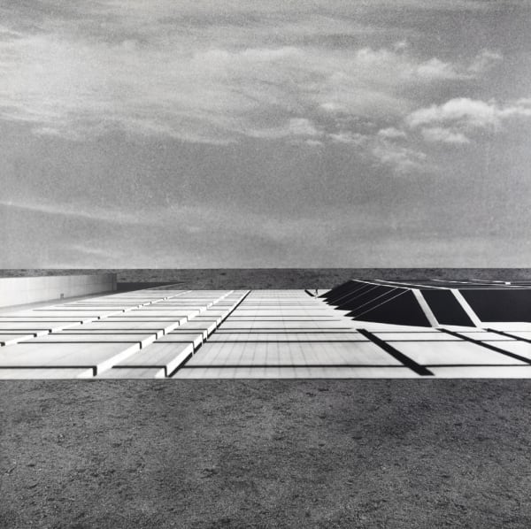 Close-up black and white photograph of a grid architectural structure in perspective