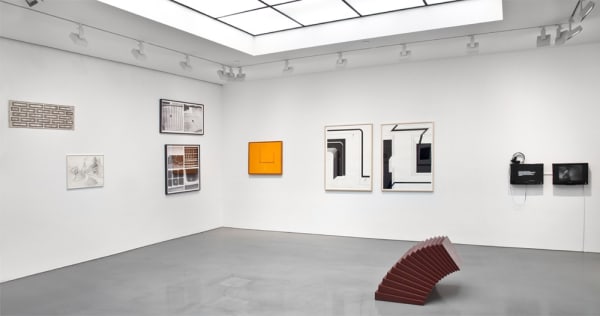 Gallery installation view of abstract paintings, found object wall sculptures