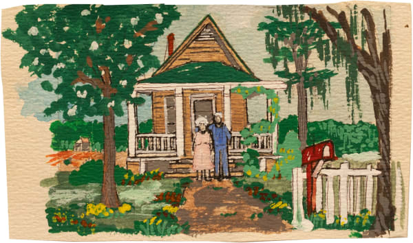 Couple standing in front of house