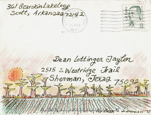 Furrowed field and cypress trees