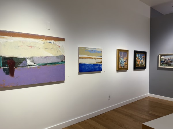 a gallery wall showing paintings by Randall Sexton