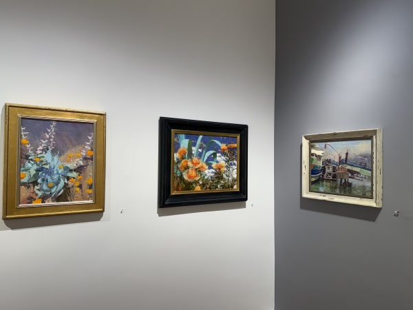 a gallery wall showing paintings by Randall Sexton