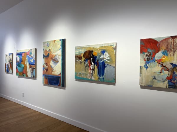 a gallery wall showing paintings by Randall Sexton