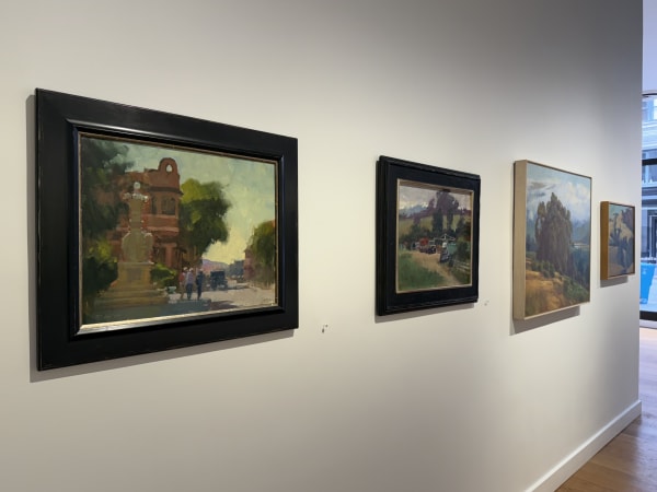 a gallery wall showing paintings by Randall Sexton