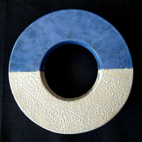 a donut shaped ceramic sculpture