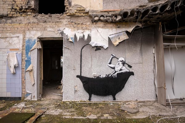 Banksy’s 2022 Man in a Bathtub mural in Horenka captures everyday life with poignant humour.