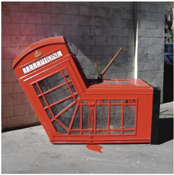 Banksy’s 2005 Vandalized Phone Box sliced and bent, powerful anti-system installation piece