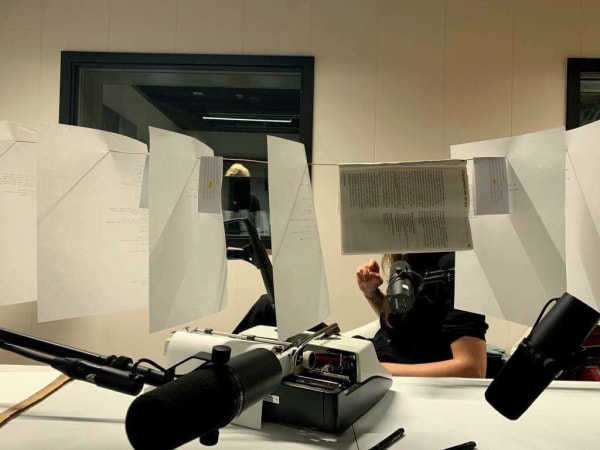 Laurence Petrone, Writing studio with Karina Beumer / 2023, 45’ (NICC to meet you, Antwerp – Ghent – Brussels) words radio studio, pen, Olympia typing machine, rice paper copper photos: Karina Beumer