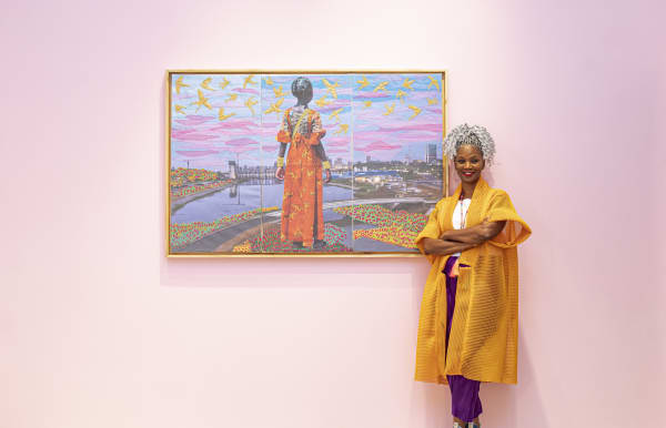 Joana Choumali in front of her work The Day Dreamer at GALERIE FARAH FAKHRI Abidjan as seen in Afrique Magazine June 2025