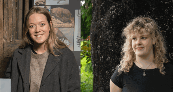 Two women standing outdoors, one in a dark coat and the other in a black shirt, with lush greenery in the background.