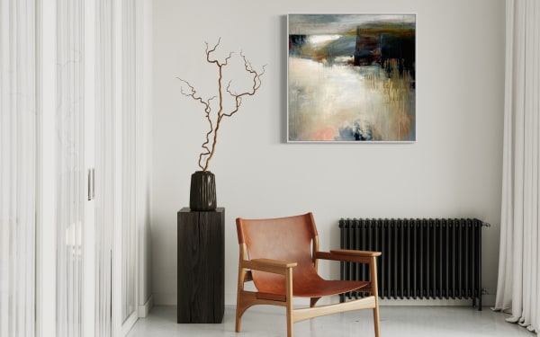 Modern living room with abstract landscape painting, featuring earthy tones and a blend of light and dark shades, hung above a radiator.