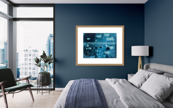 Modern bedroom interior with a blue and white abstract painting on the wall.