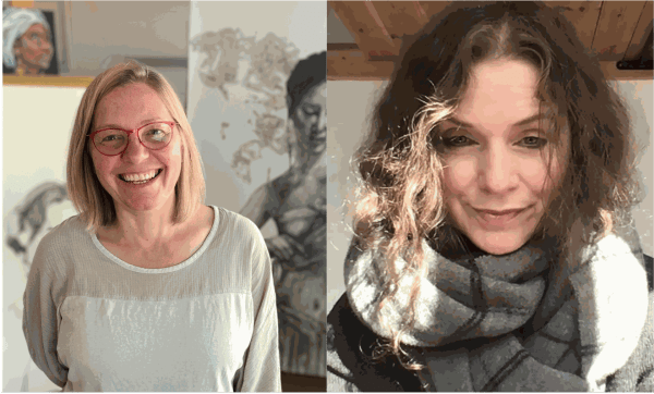 Two smiling women posing indoors with artwork in the background.