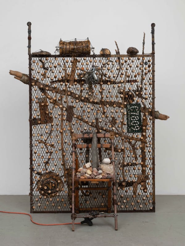 Spinning Knife, Jack Mandora Me Na Choose Nun, 1998 Stones, chair, wood, corks, metal, knife, motor, elevator gate, wire, and electrical cord 76 x 28 x 67 in 193 x 71.1 x 170.2 cm