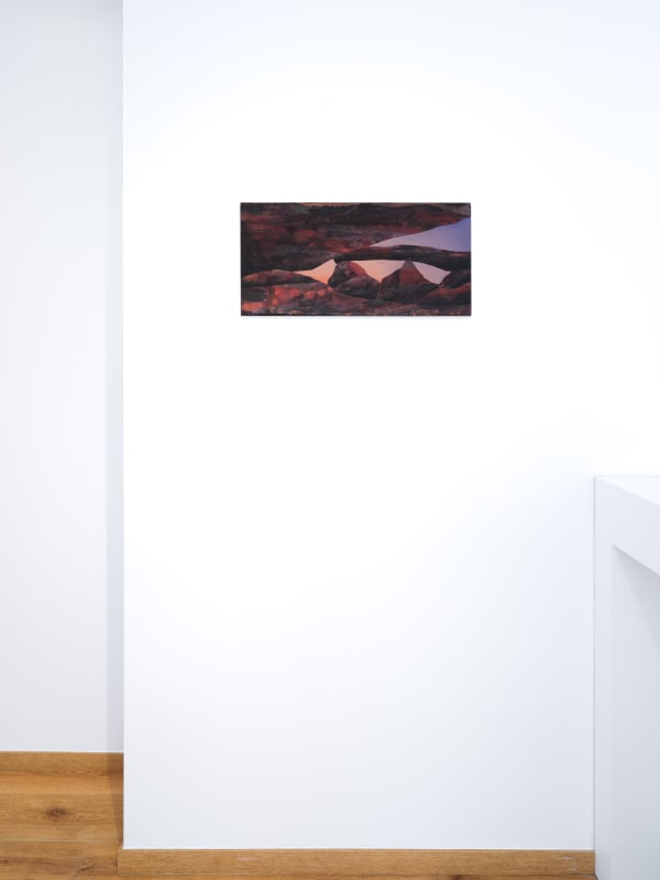 Painting titled “Callisto” (2024) by Silvia Giordani. The artwork features fragmented geological forms in muted tones of red, brown, and purple, set against a softly illuminated background, evoking a surreal and timeless landscape. Acrylic and oil on canvas. © Buysse Gallery.