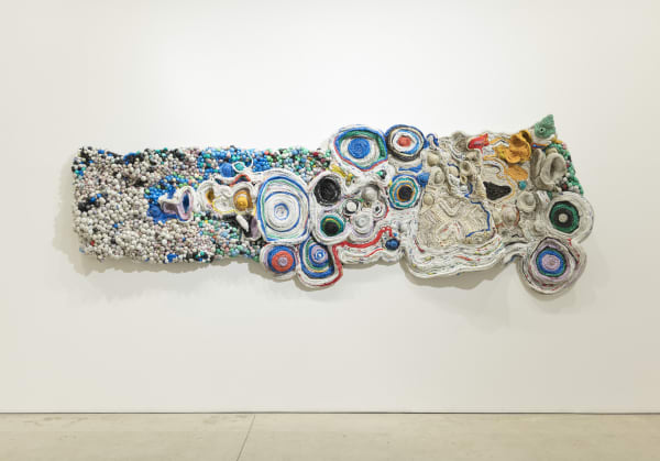 Ifeoma U. Anyaeji Eze Fuo eze anochie, (When a king leaves another replaces him – no condition is permanent) 2013 (edited 2015, 2019, 2021/2022) Plasto-yarning, Repurposed used non-biodegradable plastic bags (Plasto-yarns) bottles, wire mesh, twine, Bubblies 420 × 150 × 24 cm