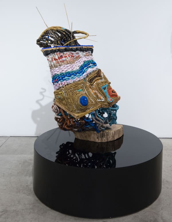 Ifeoma U. Anyaeji Ókpókóló éjùnà (Snail shell) 2023 Repurposed discarded non-biodegradable plastic bags (Plasto-yarns) and bottles, found wood, twine, metal wire, found objects, and plexiglass 125 × 120 × 132 cm