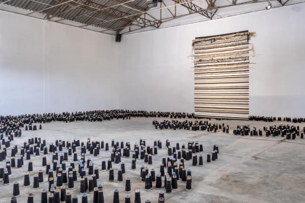 NOSTALGIA FOR A PAN-AFRICAN UTOPIA - 2022.2023 Textile and sound installation incorporating tapestry, sound and textile cones. The 260×180 cm tapestry was woven in basse lisse using Aubusson processes from a variety of fibres sourced from Tunisia, Madagascar, other African countries and France.