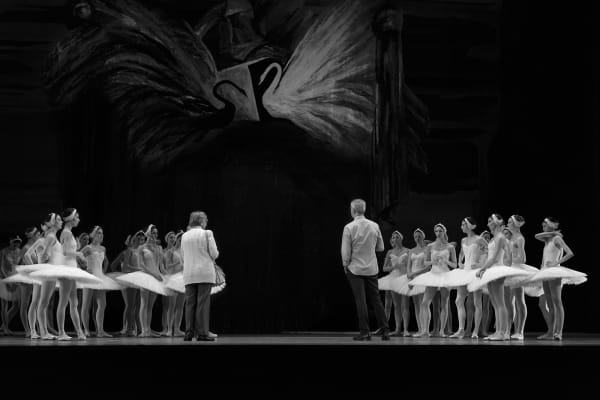 Artistic director Makhar Vaziev and artists of The Bolshoi Ballet rehearsing Swan Lake. At The Royal Opera House, London, UK. Dancers. By movement photographer Simon Tomkinson.