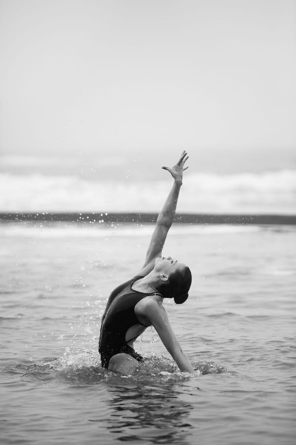 Movement study - Swimming 4. Synchronised swimmer Genevieve Randall. At Bude sea pool, Cornwall, UK. Prints of athletes. By movement photographer Simon Tomkinson.