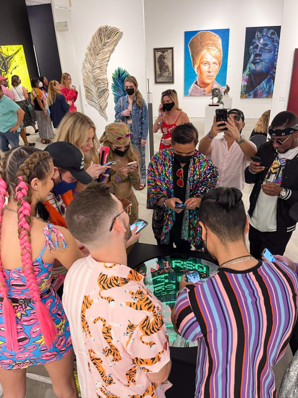 Crowd of people at Carousel Fine Art's booth at the art fair, Context Art Miami 2021.