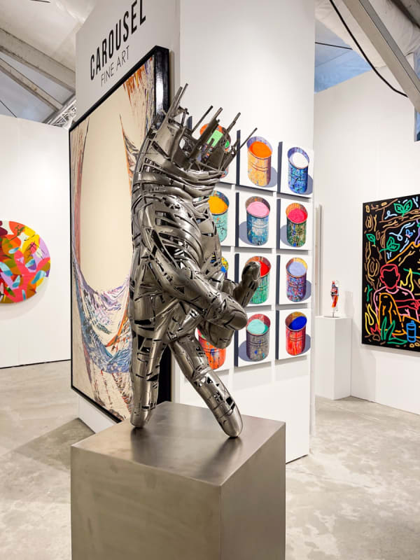Paintings and sculptures displayed at Carousel Fine Art's booth at the art fair, Context Art Miami 2021.