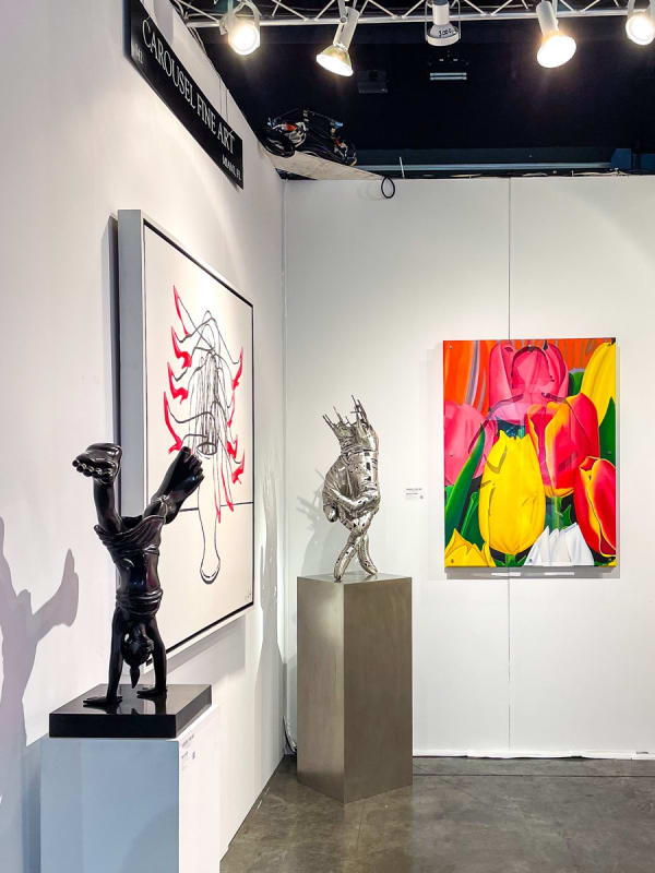 Paintings and sculpture displayed at Carousel Fine Art's booth at the Palm Beach Show art fair, 2022.