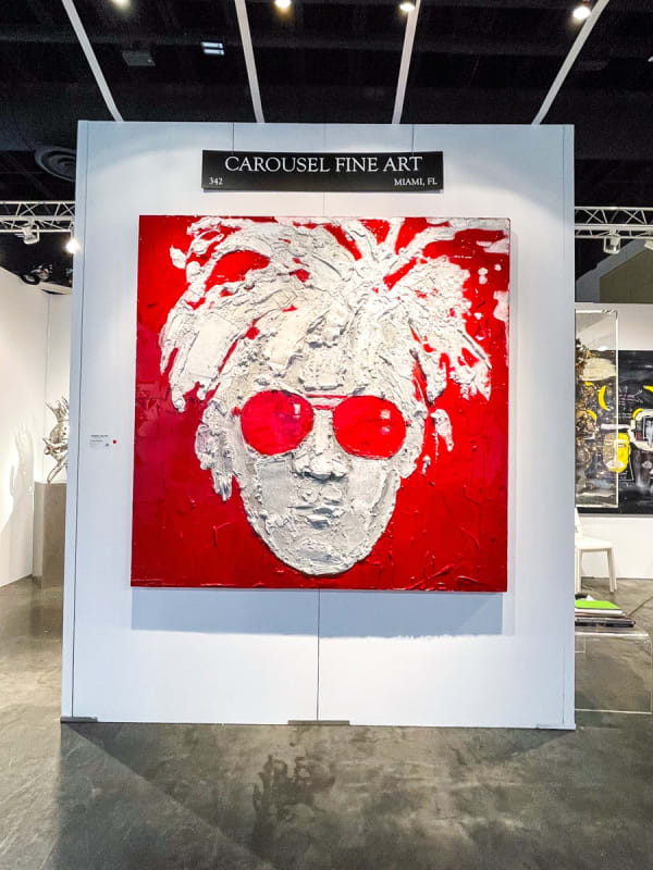 Paintings displayed at Carousel Fine Art's booth at the Palm Beach Show art fair, 2022.