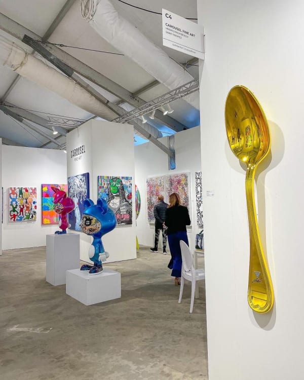 Paintings and sculptures displayed at Carousel Fine Art's booth at the art fair, Context Art Miami 2022