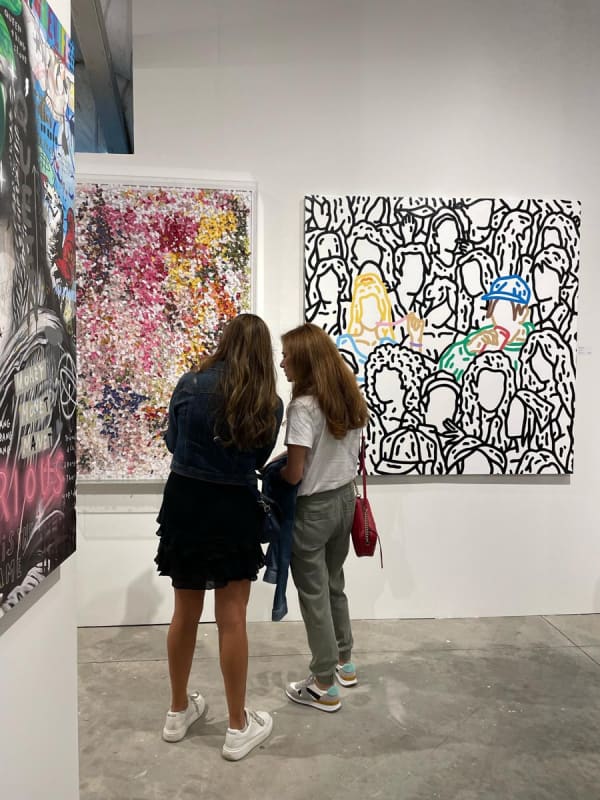 People at Carousel Fine Art's booth at the art fair, Context Art Miami 2022