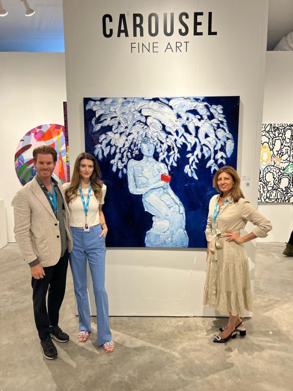 Owners of Carousel Fine Art at their booth at the art fair, Context Art Miami 2022.