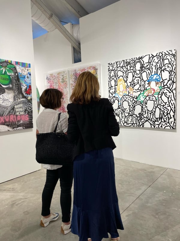 People at Carousel Fine Art's booth at the art fair, Context Art Miami 2022