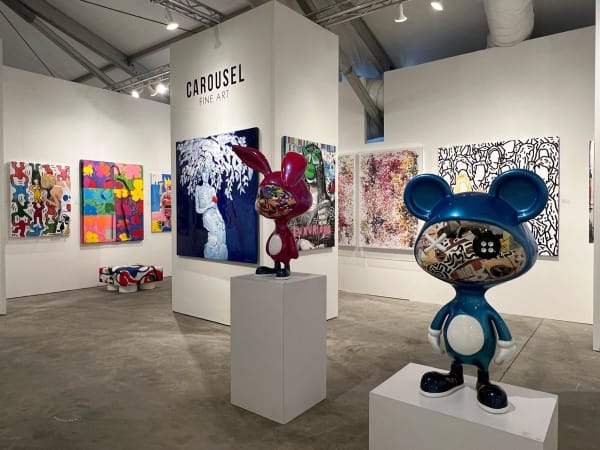 Paintings and sculptures displayed at Carousel Fine Art's booth at the art fair, Context Art Miami 2022