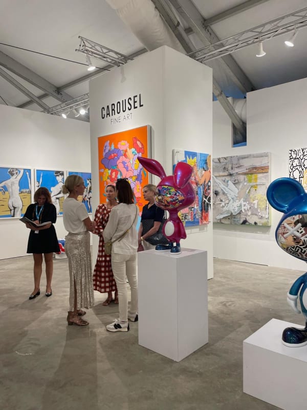 People at Carousel Fine Art's booth at the art fair, Context Art Miami 2022