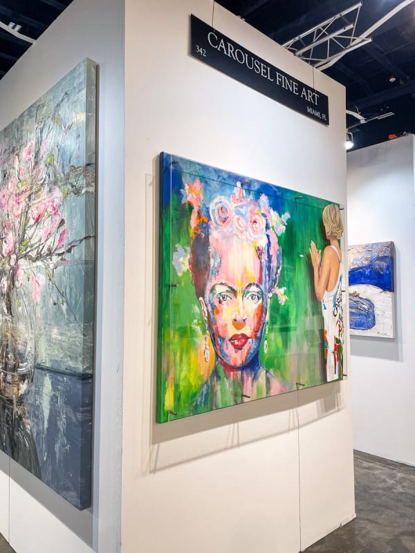 Paintings displayed at Carousel Fine Art's booth at the Palm Beach Show art fair, 2023.