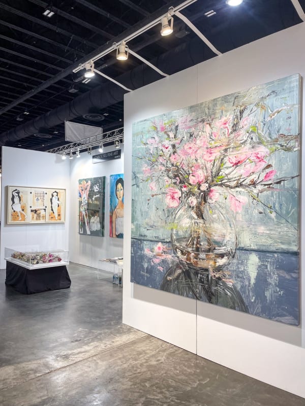 Paintings displayed at Carousel Fine Art's booth at the Palm Beach Show art fair, 2023.
