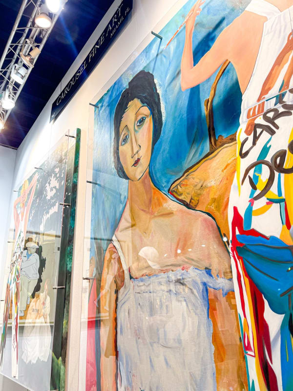 Paintings displayed at Carousel Fine Art's booth at the Palm Beach Show art fair, 2023.