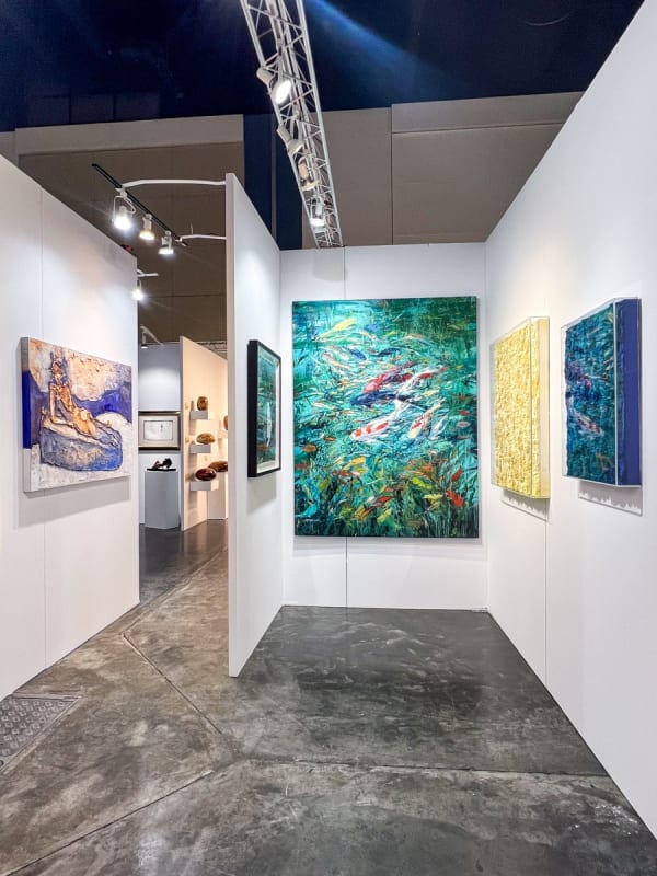 Paintings displayed at Carousel Fine Art's booth at the Palm Beach Show art fair, 2023.