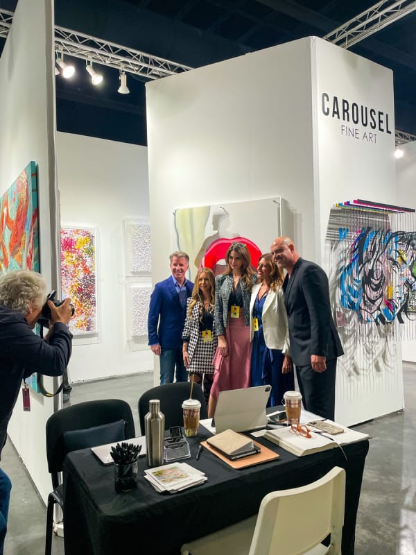 People at Carousel Fine Art's booth at Art Palm Beach, art fair 2023.