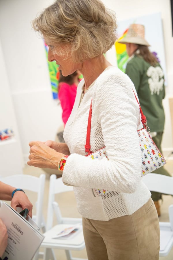 Artist Caroline Dechamby at Carousel Fine Art's gallery space in Buckhead Village, Atlanta during the Caroline Dechamby Retrospective.