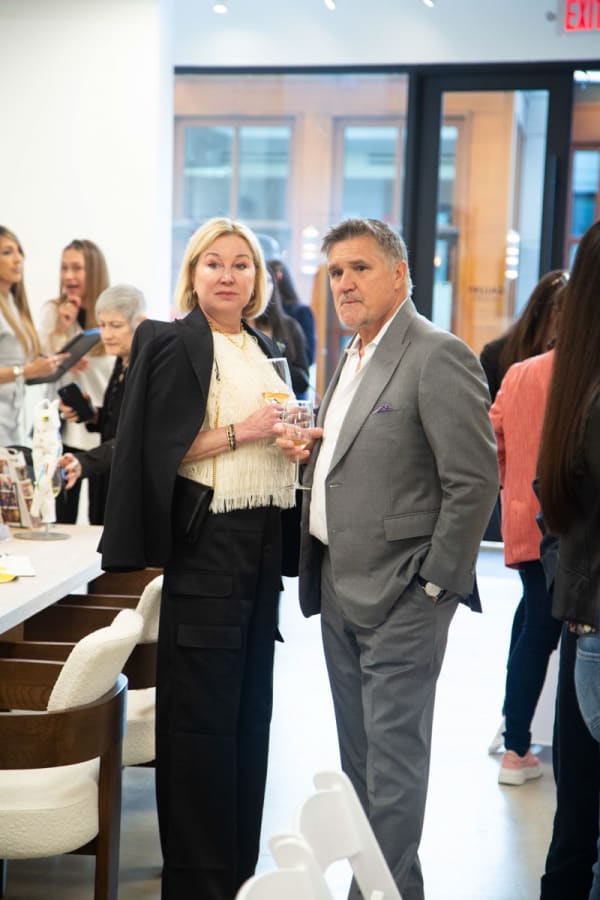People at Carousel Fine Art's gallery space in Buckhead Village, Atlanta during the Caroline Dechamby Retrospective.