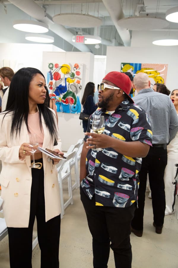 People at Carousel Fine Art's gallery space in Buckhead Village, Atlanta during the Caroline Dechamby Retrospective.
