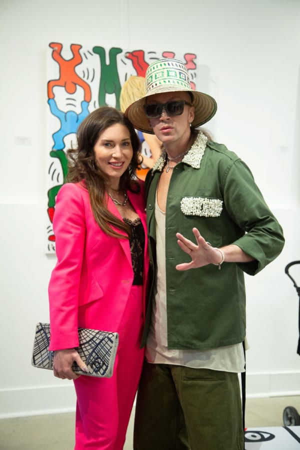 People posing at Carousel Fine Art's gallery space in Buckhead Village, Atlanta during the Caroline Dechamby Retrospective.