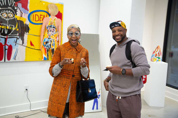 People at Carousel Fine Art's gallery space in Buckhead Village, Atlanta during the Caroline Dechamby Retrospective.