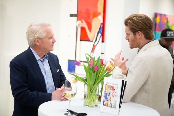 People at Carousel Fine Art's gallery space in Buckhead Village, Atlanta during the Caroline Dechamby Retrospective.