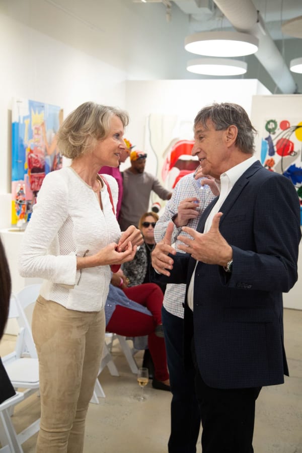 People at Carousel Fine Art's gallery space in Buckhead Village, Atlanta during the Caroline Dechamby Retrospective.