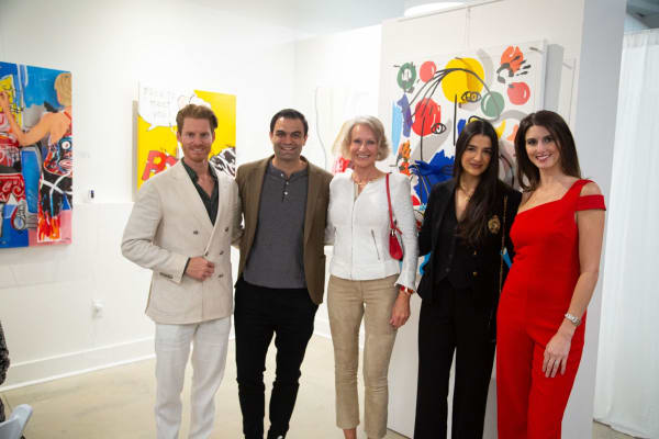 People at Carousel Fine Art's gallery space in Buckhead Village, Atlanta during the Caroline Dechamby Retrospective.
