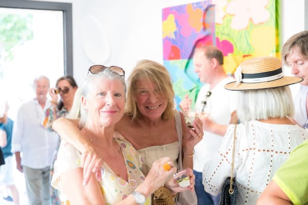 People inside of Carousel Fine Art's gallery space in Saint Tropez.